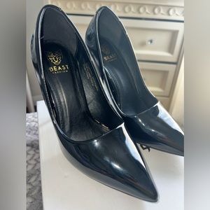 Black pointed toe pumps